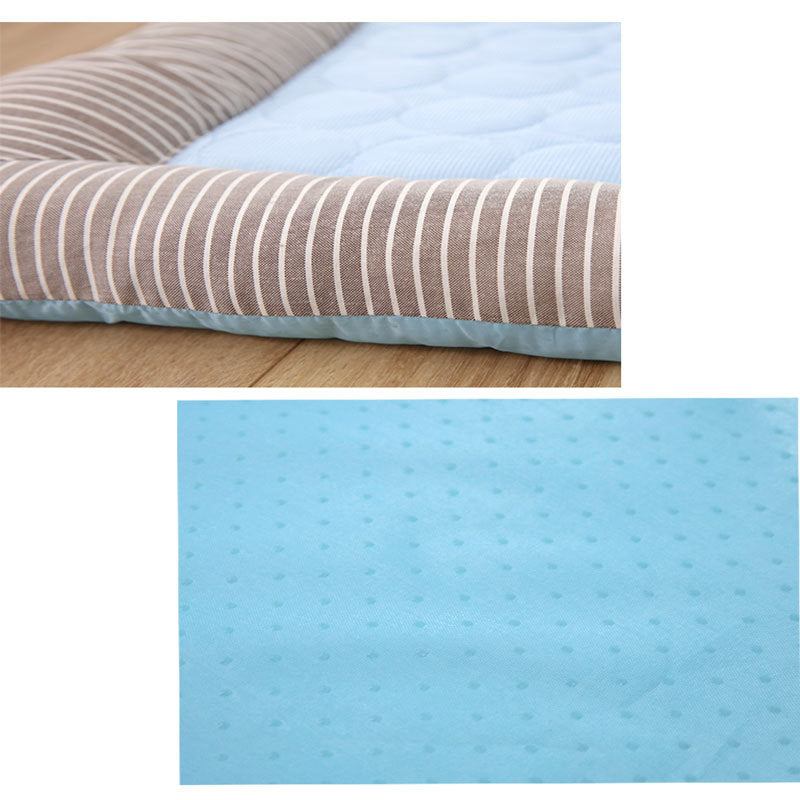 Dog lying on ice silk cooling mat